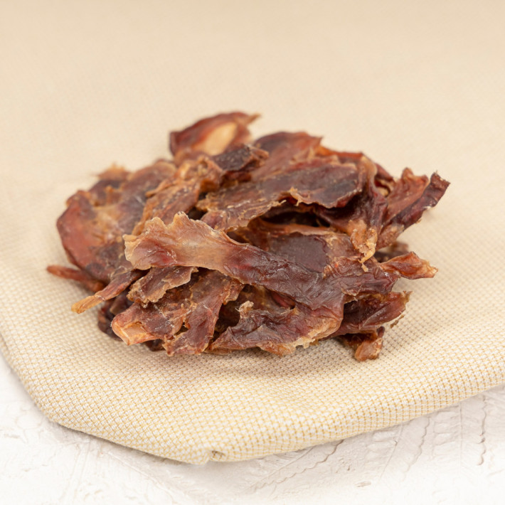 Натуральні сушені ласощі для собак Шлунок курячий сушений слайсами 100 г - фото №4